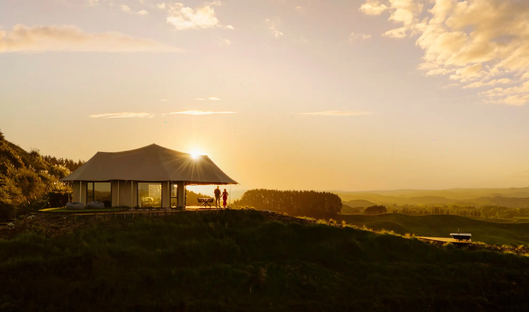 Kōwhai Tent at sunset, Wild Canvas Waitomo