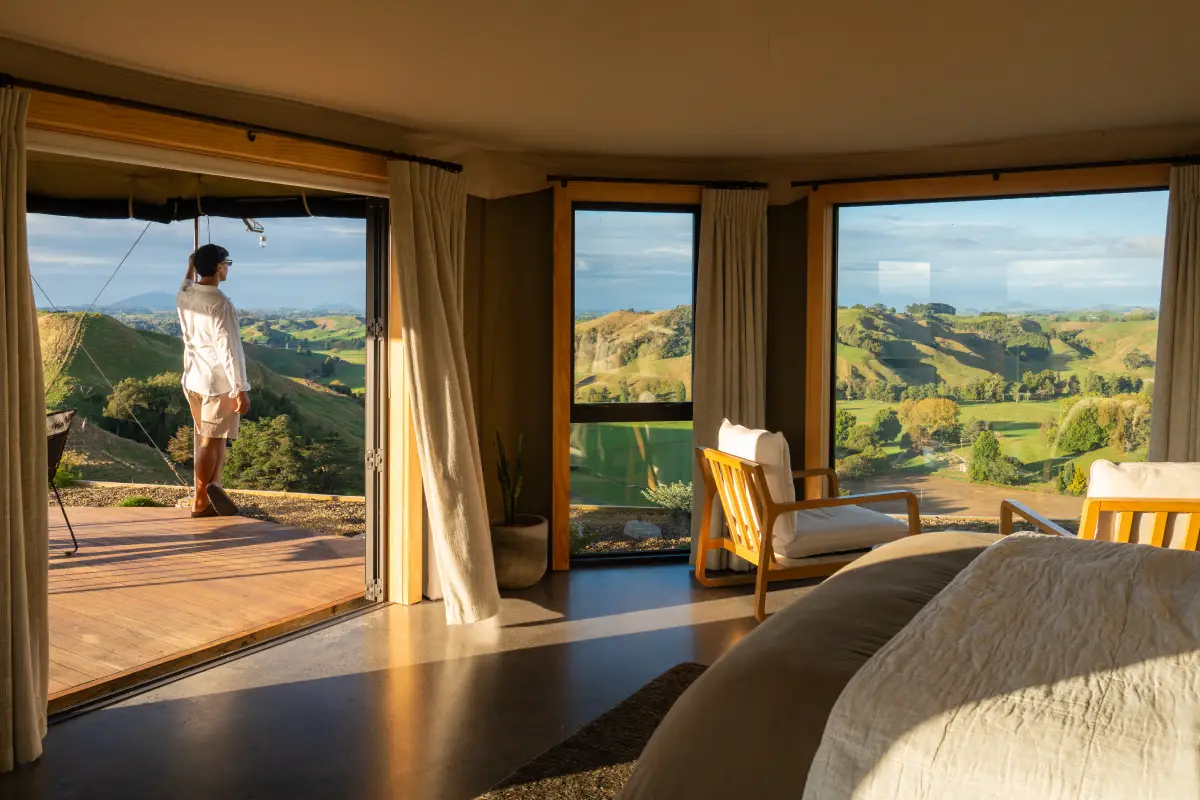 Couple arriving at Kōwhai Tent, romantic getaway Waitomo New Zealand