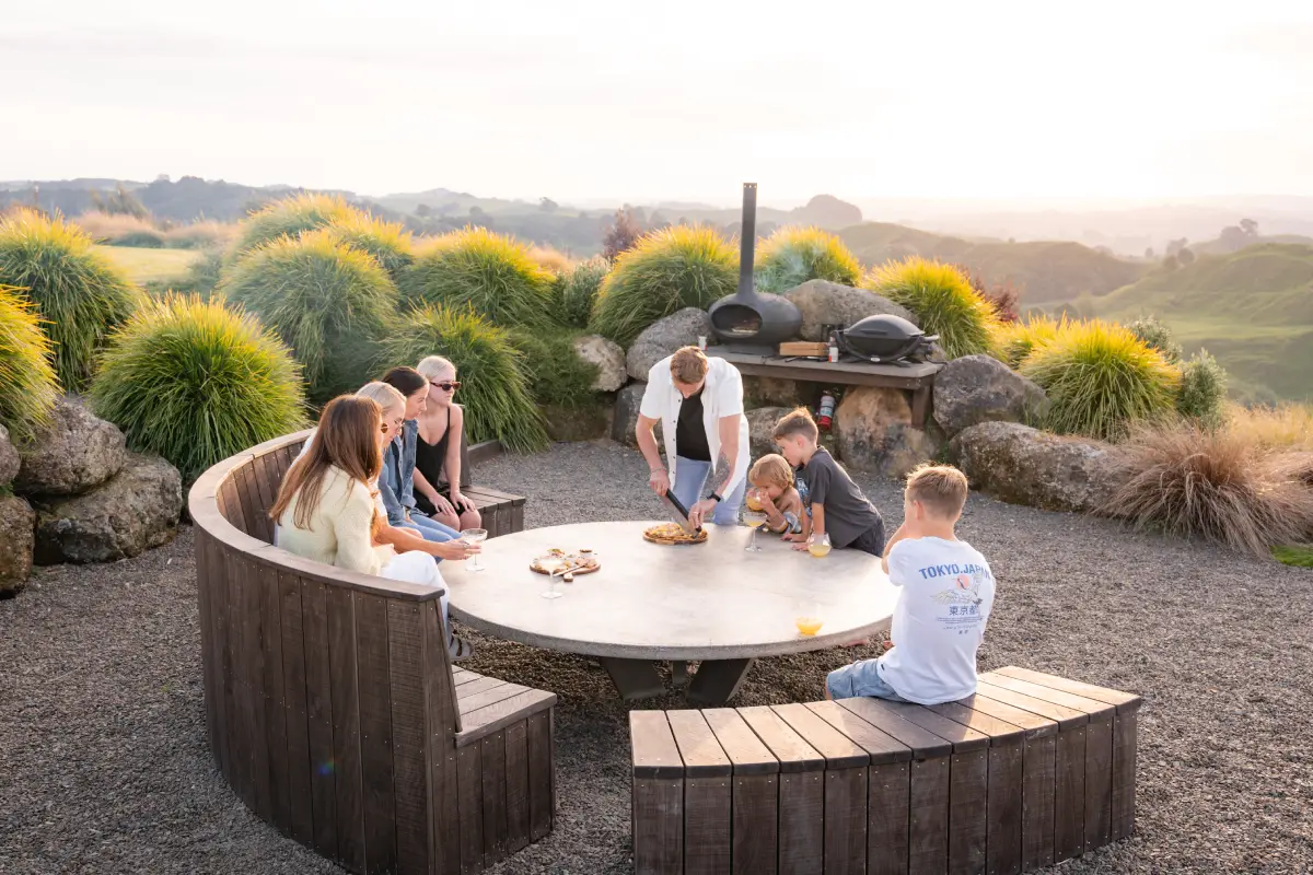 Pōhutukawa Tent cedar hot tub at sunrise with mist and panoramic views, Waitomo