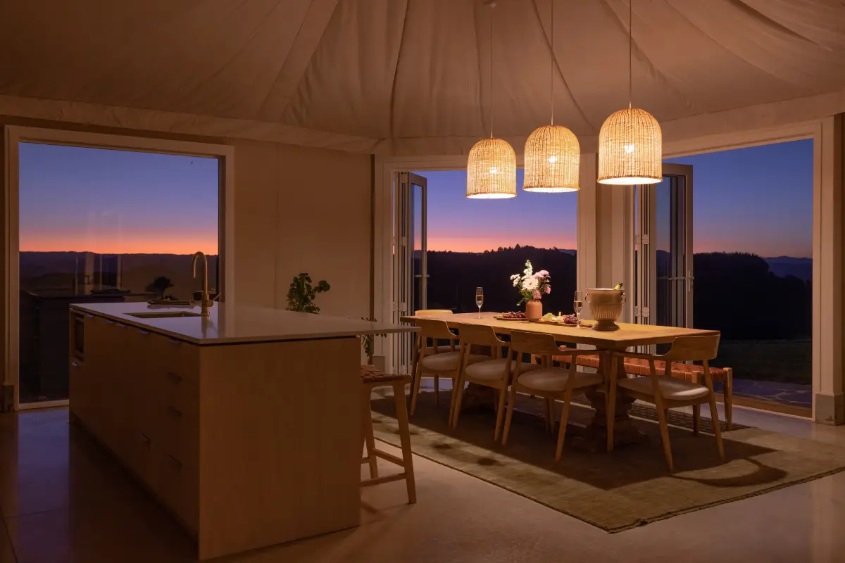Pōhutukawa Tent ensuite bathroom with bedroom view and brass fixtures, NZ