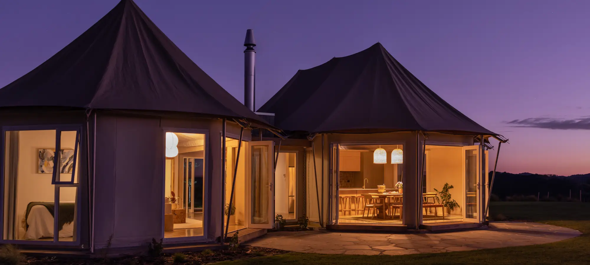 Wild Canvas Pōhutukawa tent at dusk Waitomo New Zealand
